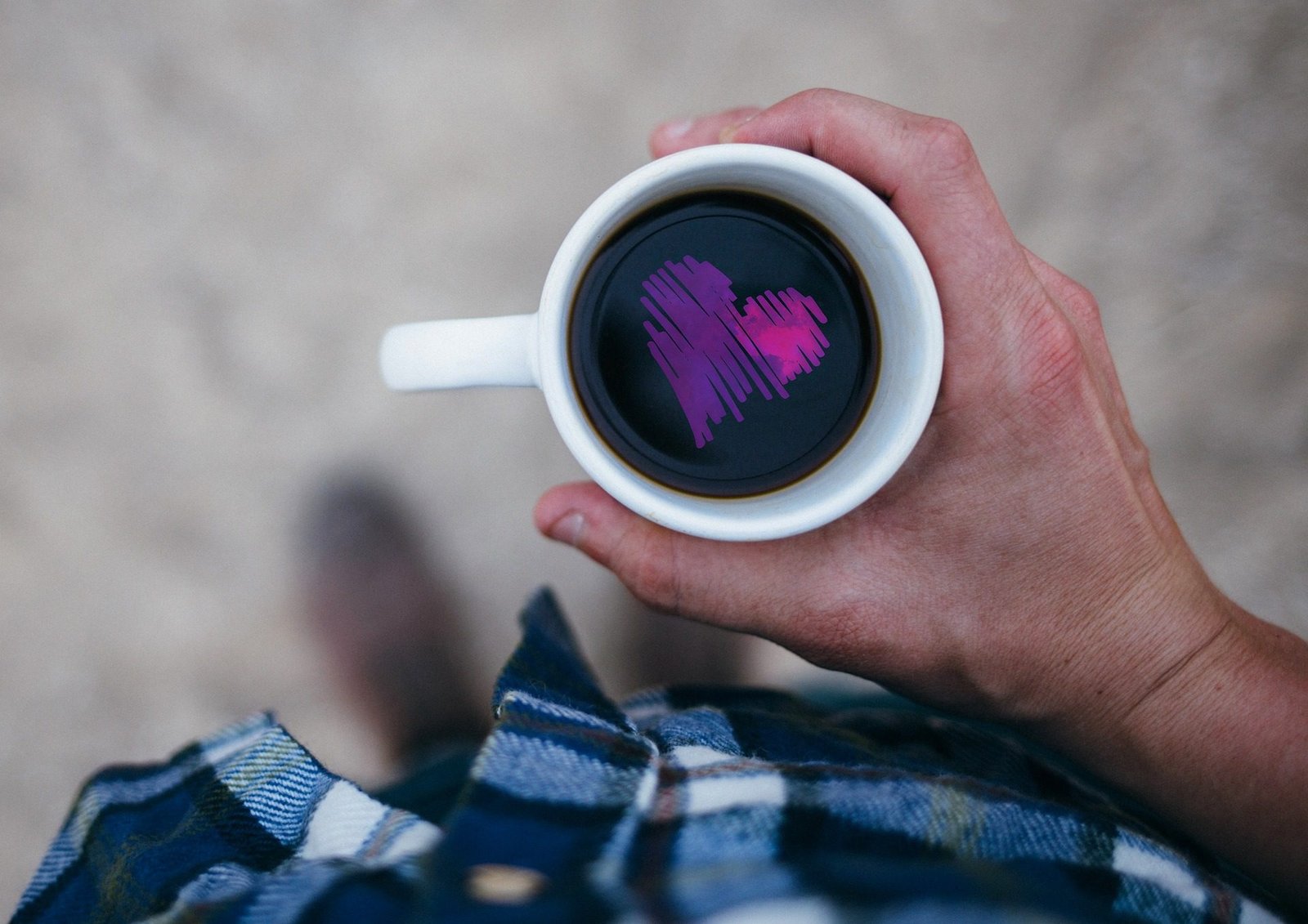 Self-love Man holding mug with a heart in the coffee